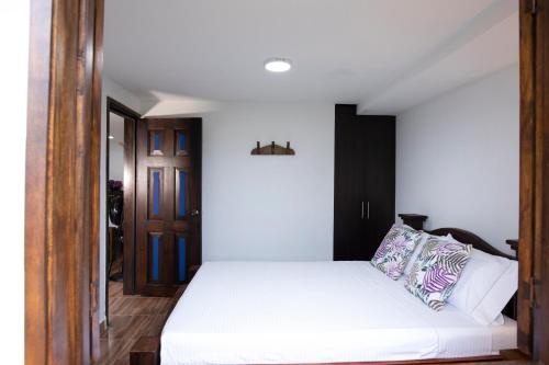 Ένα ή περισσότερα κρεβάτια σε δωμάτιο στο HOTEL YANUBA CAMPESTRE