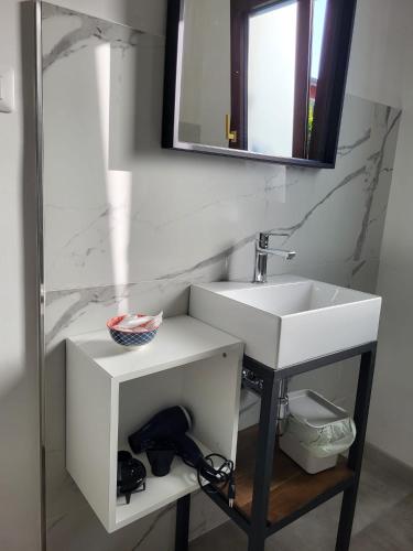 a bathroom with a white sink and a mirror at Casa MaLa’ in Ceprano