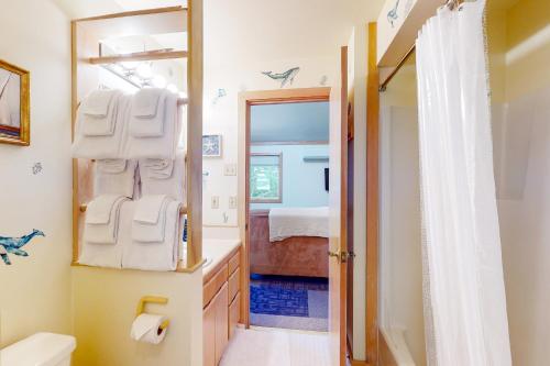 a bathroom with a sink and a mirror at Beachcombers Hideaway in Florence