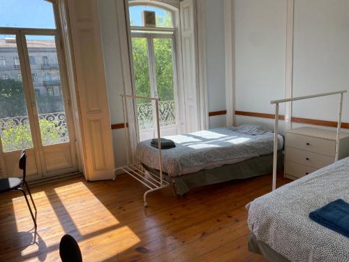 Postel nebo postele na pokoji v ubytování Room in Lisbon centre