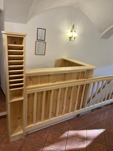 a room with a wooden wall with a shelf at Beim Hanslbauer in Reit im Winkl