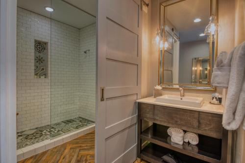 a bathroom with a sink and a shower at The Tavern Hotel in Cottonwood