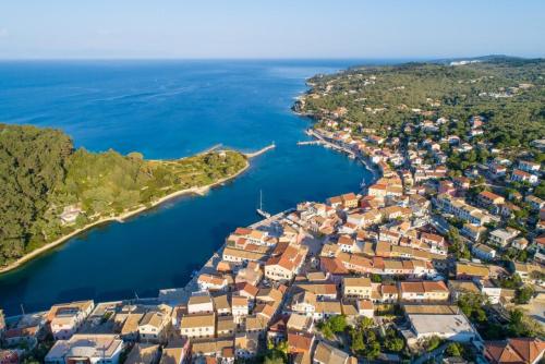 an aerial view of a town next to the water at Dimitris Cottage in Apergátika