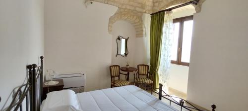 Ένα ή περισσότερα κρεβάτια σε δωμάτιο στο Torre Bruno