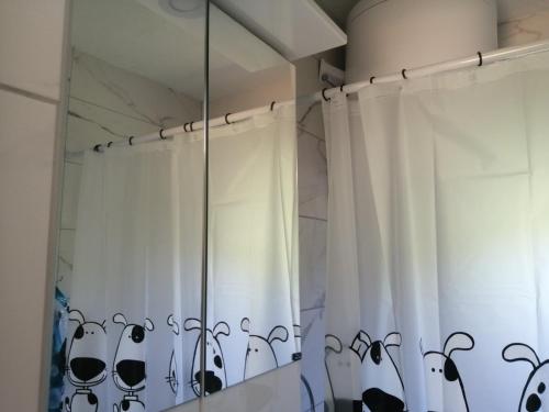a shower curtain with black and white cats on it at Zelena livada (Green Meadow) in Bijelo Polje