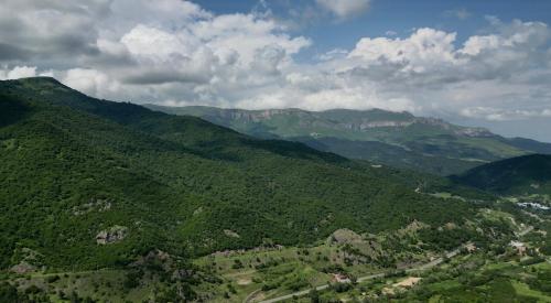 an aerial view of a green valley with mountains at Deghceni clubhouse in Dilijan