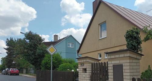 a house with a sign in front of it at Apartmán Alena in Karlovy Vary