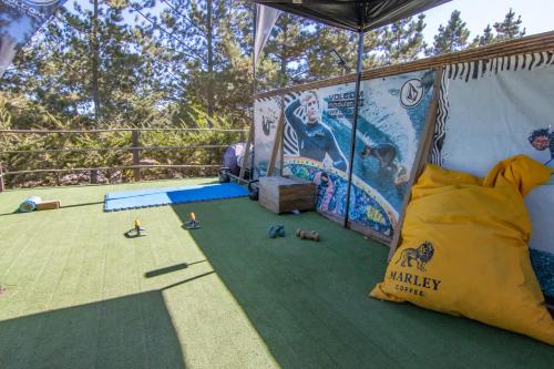an indoor play area with a bounce house and an inflatable at Sirena Insolente Hostel & Suites in Pichilemu