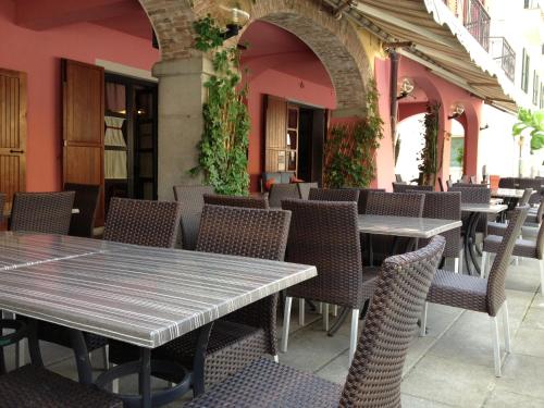 a row of tables and chairs in a restaurant at Albergo Ristorante La Rocca in Firenzuola