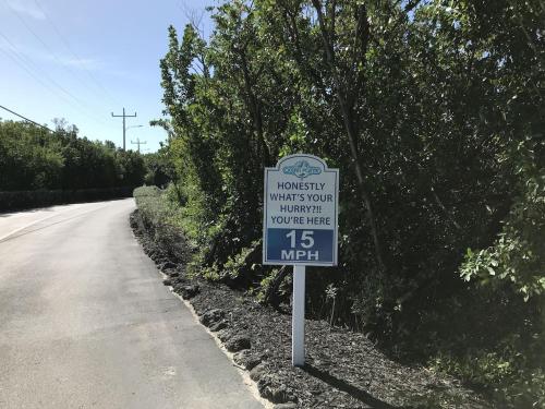a sign that is on the side of a road at Tropical Getaway w/Private Beach 1 BD Condo in Tavernier