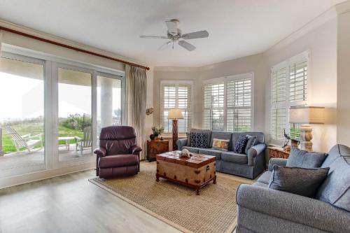 a living room with a couch and a table at Ocean Place Condo in Amelia Island