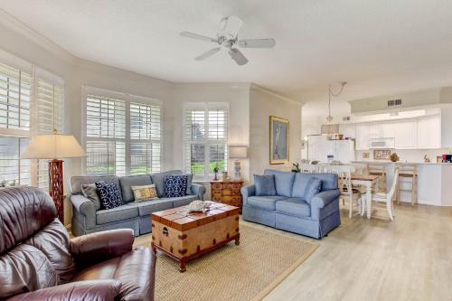 a living room with two couches and a table at Ocean Place Condo in Amelia Island