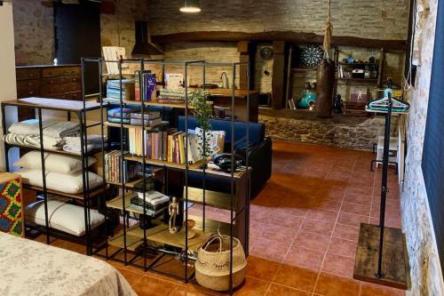 a room with a book shelf filled with books at Mirador Yellow Door in Ponferrada