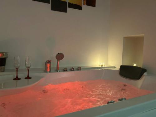a bath tub filled with red water in a room at Aurosa Vacanze in Alliste