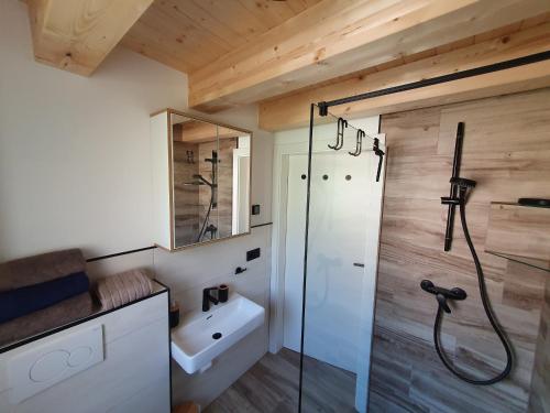 a bathroom with a shower and a sink at Alpensuss in Kötschach