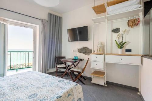 Postel nebo postele na pokoji v ubytování ALBERTA Rooms Manarola