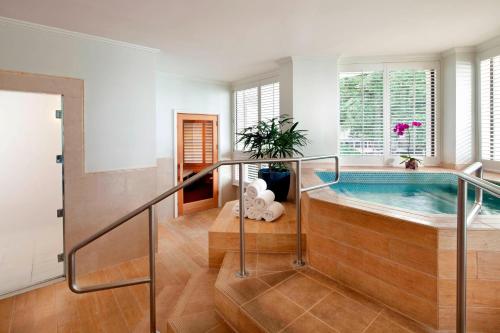 a house with a swimming pool in a room at Moana Surfrider, A Westin Resort & Spa, Waikiki Beach in Honolulu