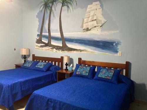 Postel nebo postele na pokoji v ubytování Las Lajas Beach Resort