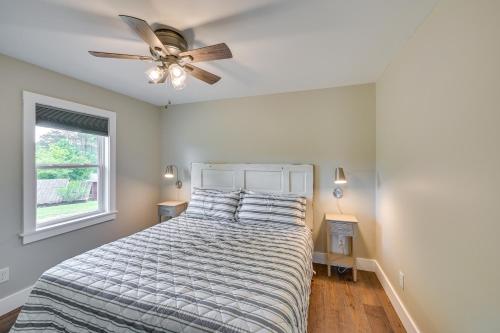 a bedroom with a bed with a ceiling fan at Pickens Cottage about 5 Mi to Table Rock State Park! in Lakemont