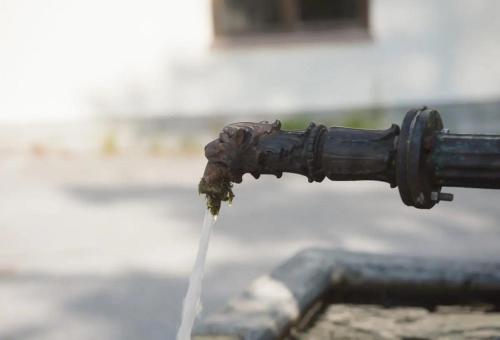 a water faucet with water coming out of it at SIEGLGUT in Altaussee