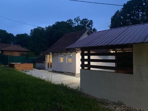 a house with a garage and a building at Iskra DDUR in Gornji Milanovac