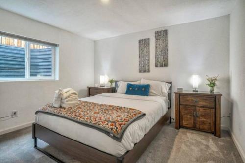 a bedroom with a large bed and a window at 2 bedroom* Minutes from downtown *Firepit in Colorado Springs
