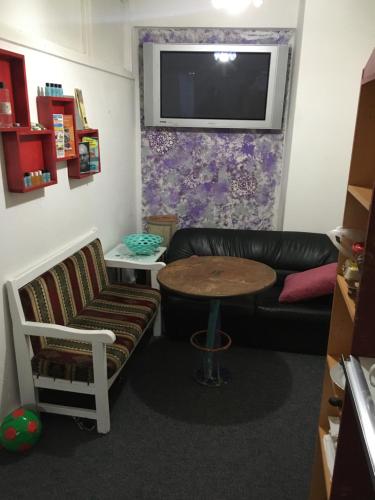 a living room with a couch and a table at Hostel Taksim in Istanbul
