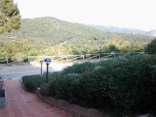 a view of a road with mountains in the background at Allegroitalia Elba Golf in Portoferraio