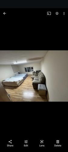 a picture of a room with two beds in it at oldham town centre double room 5 in Oldham