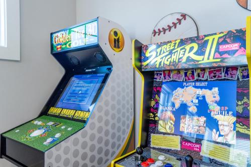 a video game arcade with a baseball game at ~Spacious home near beach w/ game room and community pool~ in Orange Beach