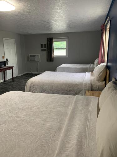 Postel nebo postele na pokoji v ubytování ROYALINN