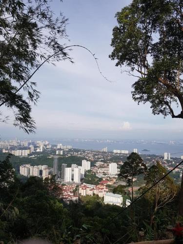 a view of a city with buildings in the distance at Sabai Sabai Guesthouse in Bayan Lepas in Bayan Lepas