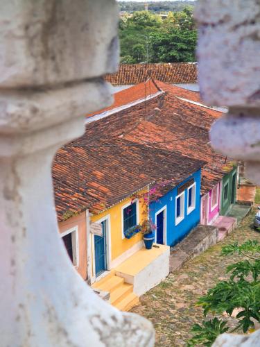 a view of a group of houses with colorful doors at Casa Igarassu in Igarassu