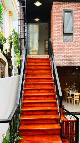 a set of stairs leading up to a building at BuBu House in Vung Tau