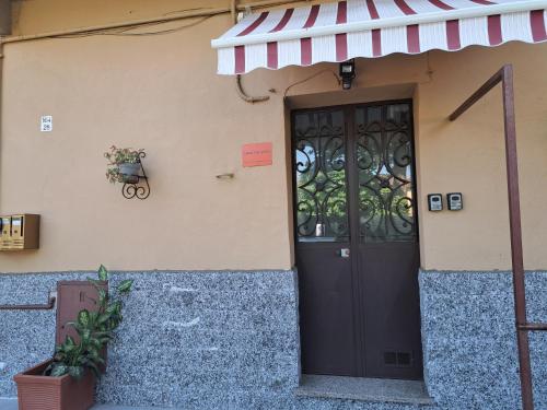 a door to a building with a sign on it at Juventus Stadium - comfort e relax in Turin