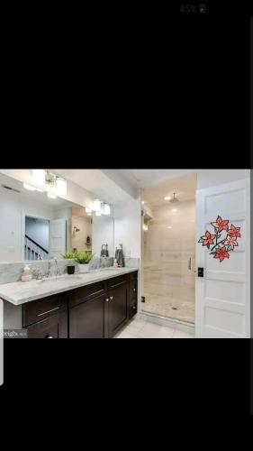 a kitchen with a sink and a white refrigerator at Fleet st Property in Baltimore