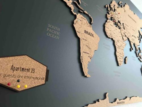 a map of the world with a box of pins at Schöne 2 Zimmerwohnung in Heusenstamm in Heusenstamm
