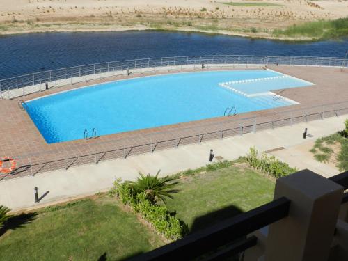 an overhead view of a large swimming pool at Apartment La Isla Terrazas de la Torre I in Roldán