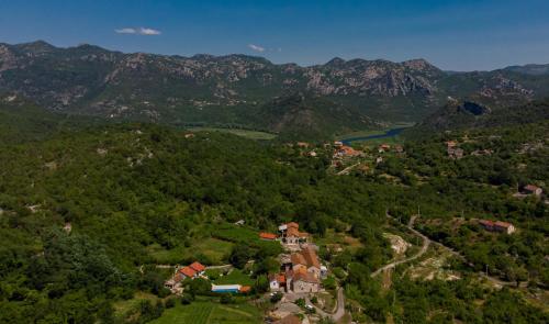 an aerial view of a village in the mountains at Country Homes Dujeva in Rijeka Crnojevića