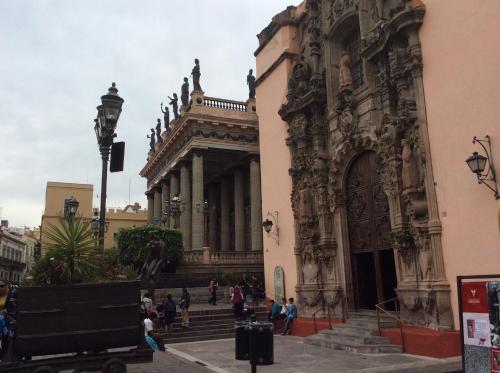 a large building with a statue in front of it at Casa del Agua in Guanajuato