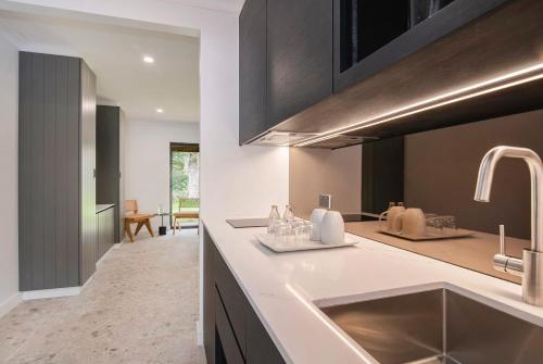 a kitchen with a sink and a counter top at Chambré Estate in Margaret River Town