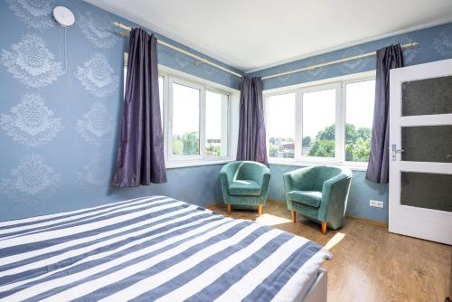 Llit o llits en una habitació de Raivet Apartment