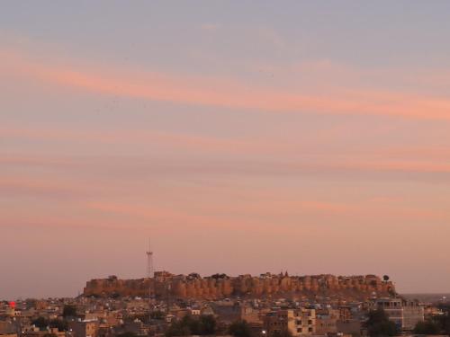 a view of a city at sunset at Bob Cafe & Guest House Jaisalmer in Jaisalmer