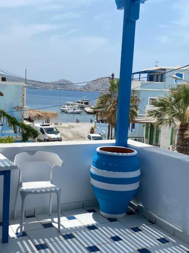 a blue and white vase sitting on a balcony at GIAVASI SEASIDE FINIKI in Foinikion