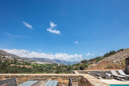 a view from the roof of a villa with a swimming pool at Maris Villas in Elounda