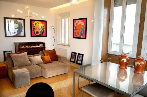 a living room with a couch and a glass table at Villa La Torretta Luxury B&B - Adults Only - in Rimini