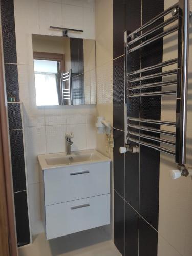 a bathroom with a sink and a mirror at Berlin Hotel Nisantasi in Istanbul