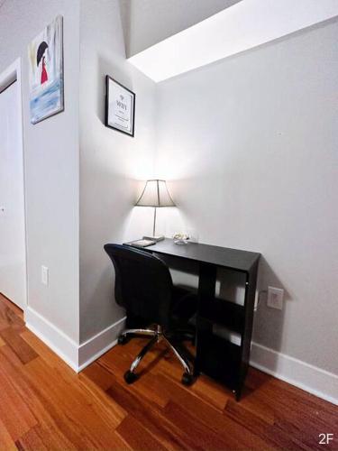 a desk with a chair and a lamp in a room at Renovated Private 1B/1B w/ Kitchen in Philadelphia