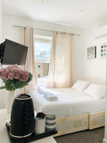 Voodi või voodid majutusasutuse Wembar Hotel toas