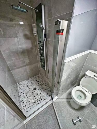 a bathroom with a shower and a toilet at Renovated Private 1B/1B W/ Kitchen in Philadelphia